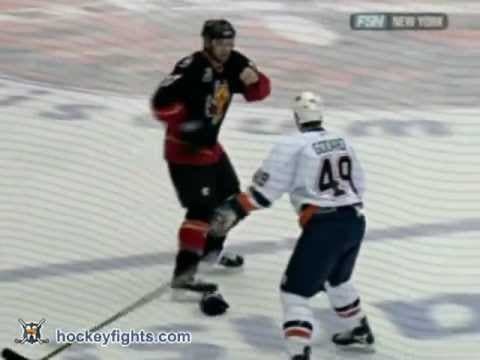 C. Simon (CAL) vs. E. Godard (NYI)