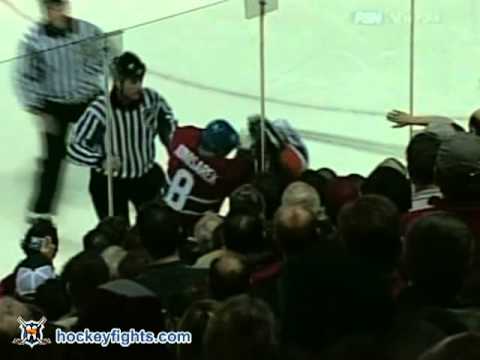 E. Godard (NYI) vs. M. Komisarek (MON)